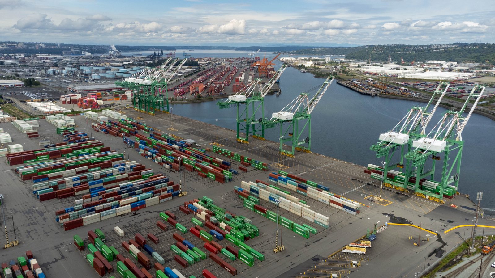 An aerial view of the Port of Tacoma shipping container yard, representing the industrial and commercial sectors protected by Diligence Security.